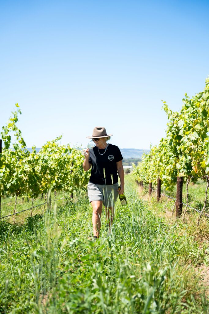 Queen of Fiano Corrina Wright in Fiano vineyard at Oliver's Taranga